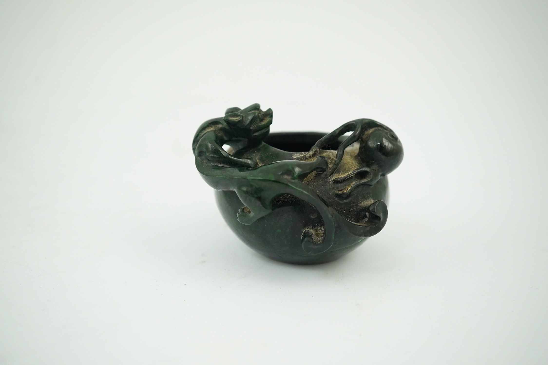 A Chinese dragon carved green hardstone brushwasher, 5cm high. Condition - good